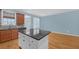 Well-appointed kitchen island with granite countertops, storage, and views of the exterior at 6206 Carriage Gate Se Ln # 6, Mableton, GA 30126