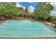 Large community swimming pool with surrounding lounge chairs and lush landscaping at 6206 Carriage Gate Se Ln # 6, Mableton, GA 30126