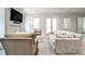 Bright living space featuring two couches, natural lighting, and a large screen TV at 156 Lake Forrest Ne Ln, Atlanta, GA 30342