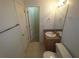 Bright bathroom with tile flooring, a single sink vanity, and a toilet at 6016 Creekerton Blvd, Mcdonough, GA 30252
