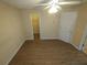 Spacious bedroom featuring wood-look floors and a ceiling fan with a light at 6016 Creekerton Blvd, Mcdonough, GA 30252