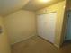 Bedroom featuring carpet and a double door closet with 'utility closet' label at 6016 Creekerton Blvd, Mcdonough, GA 30252