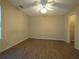 Large main bedroom with modern ceiling fan, walk-in closet and wood-look floors at 6016 Creekerton Blvd, Mcdonough, GA 30252