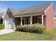 Charming single-story home featuring a stone facade, red shutters, and a well-maintained front yard at 6016 Creekerton Blvd, Mcdonough, GA 30252