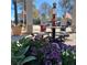Vintage gas pumps and patio seating adorned with colorful flowers at 6016 Creekerton Blvd, Mcdonough, GA 30252