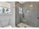 Modern bathroom features large shower with glass enclosure and built-in niche at 9429 Golfview Pt, Villa Rica, GA 30180