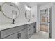 Modern bathroom with dual vanity, framed mirrors, sleek hardware, and bright lighting at 9429 Golfview Pt, Villa Rica, GA 30180