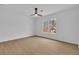 Bright bedroom with hardwood floors and a large window with scenic backyard view at 9429 Golfview Pt, Villa Rica, GA 30180