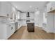 Bright kitchen features stainless steel appliances, central island and white cabinets at 9429 Golfview Pt, Villa Rica, GA 30180
