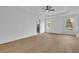 Large main bedroom features tray ceiling, windows, and an adjacent bathroom at 9429 Golfview Pt, Villa Rica, GA 30180
