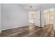 Bedroom with hardwood floors, and entryways to the kitchen and bathroom at 955 Juniper St # 3026, Atlanta, GA 30309