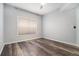 Bedroom with hardwood floors, a ceiling fan, and a large window at 955 Juniper St # 3026, Atlanta, GA 30309