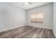 This bedroom features updated wood-look flooring and a modern ceiling fan at 955 Juniper St # 3026, Atlanta, GA 30309