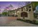 Exterior view of Tuscany Condominiums showing manicured landscaping and brick entrance with signage at 955 Juniper St # 3026, Atlanta, GA 30309
