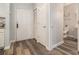 Apartment entryway featuring hardwood floors, closet, and bathroom at 955 Juniper St # 3026, Atlanta, GA 30309