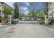 Community gated entrance with brick paved drive, security cameras, and controlled access at 955 Juniper St # 3026, Atlanta, GA 30309