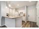 Bright kitchen features white cabinets, modern appliances and backsplash, and a breakfast bar at 955 Juniper St # 3026, Atlanta, GA 30309