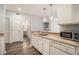 Open kitchen featuring breakfast bar with stainless steel sink and dishwasher at 955 Juniper St # 3026, Atlanta, GA 30309