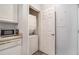 Convenient laundry closet with washer and dryer located next to the kitchen at 955 Juniper St # 3026, Atlanta, GA 30309