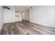 Open living room with kitchen view, large window, hardwood floors and tv wall mount at 955 Juniper St # 3026, Atlanta, GA 30309