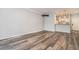 Open living room with kitchen view, large window, hardwood floors and tv wall mount at 955 Juniper St # 3026, Atlanta, GA 30309