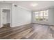 Spacious living room with a large window, hardwood floors, and plenty of natural light at 955 Juniper St # 3026, Atlanta, GA 30309