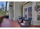 The back deck offers seating, potted plants, and a peaceful spot to relax at 9600 Poplar Ct, Douglasville, GA 30135