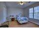 Simple bedroom with a single bed and window at 9600 Poplar Ct, Douglasville, GA 30135