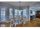 Cozy dining room with wood floors, natural light, and classic chandelier at 9600 Poplar Ct, Douglasville, GA 30135