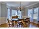 Elegant dining area with wainscoting and natural light at 9600 Poplar Ct, Douglasville, GA 30135
