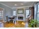 Bright dining room with marble fireplace and hardwood floors at 9600 Poplar Ct, Douglasville, GA 30135