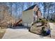 Brick and siding exterior with attached garage and landscaped yard on a sunny day at 9600 Poplar Ct, Douglasville, GA 30135