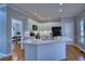 Modern kitchen with white cabinetry, a quartz countertop island, and stainless steel appliances at 9600 Poplar Ct, Douglasville, GA 30135