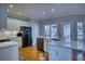 Eat-in kitchen features granite countertops, stainless appliances, and ample cabinet space at 9600 Poplar Ct, Douglasville, GA 30135