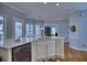 Bright kitchen with a central island featuring quartz countertops and stainless steel appliances at 9600 Poplar Ct, Douglasville, GA 30135