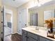 Bathroom featuring a bright vanity with a modern countertop and mirror, showcasing a stylish and functional design at 1318 Avington Glen Dr, Lawrenceville, GA 30045