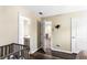 Bedroom featuring hardwood floors and multiple entry doors, showcasing a layout with easy access at 1318 Avington Glen Dr, Lawrenceville, GA 30045