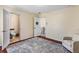 Bedroom featuring hardwood floors, a neutral color scheme, and bright natural light with attached restroom at 1318 Avington Glen Dr, Lawrenceville, GA 30045