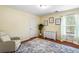 Bedroom featuring hardwood floors, a neutral color scheme, and bright natural light at 1318 Avington Glen Dr, Lawrenceville, GA 30045