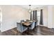 The dining room has a modern chandelier, decorative trim, and large windows that offer natural light at 1318 Avington Glen Dr, Lawrenceville, GA 30045