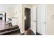 Inviting entryway featuring hardwood floors, a convenient home office nook, and a door to the lower level at 1318 Avington Glen Dr, Lawrenceville, GA 30045