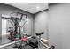 Home exercise room equipped with gym equipment, a large mirror, and rubber flooring at 1318 Avington Glen Dr, Lawrenceville, GA 30045