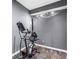 Home exercise area with an elliptical machine, track lighting, and durable flooring at 1318 Avington Glen Dr, Lawrenceville, GA 30045