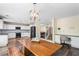 Open kitchen featuring stainless steel appliances, a dining area and a staircase to the upper level at 1318 Avington Glen Dr, Lawrenceville, GA 30045