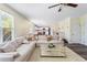 Bright living room with neutral sofa and hardwood floors at 1318 Avington Glen Dr, Lawrenceville, GA 30045