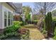 Lush backyard featuring an amazing landscape with a retaining wall and garden for flowers at 2235 Chestnut Pass, Decatur, GA 30033