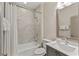 Contemporary bathroom with a shower-tub combination, large mirror and neutral accents at 2235 Chestnut Pass, Decatur, GA 30033