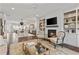 Living room featuring built in bookshelves, a fireplace, and hardwood floors at 2235 Chestnut Pass, Decatur, GA 30033