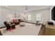 Cozy living room featuring a ceiling fan, two windows and stylish neutral decor at 2235 Chestnut Pass, Decatur, GA 30033