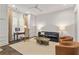 Comfortable living room features a sofa, desk, storage, and lots of natural light at 2235 Chestnut Pass, Decatur, GA 30033